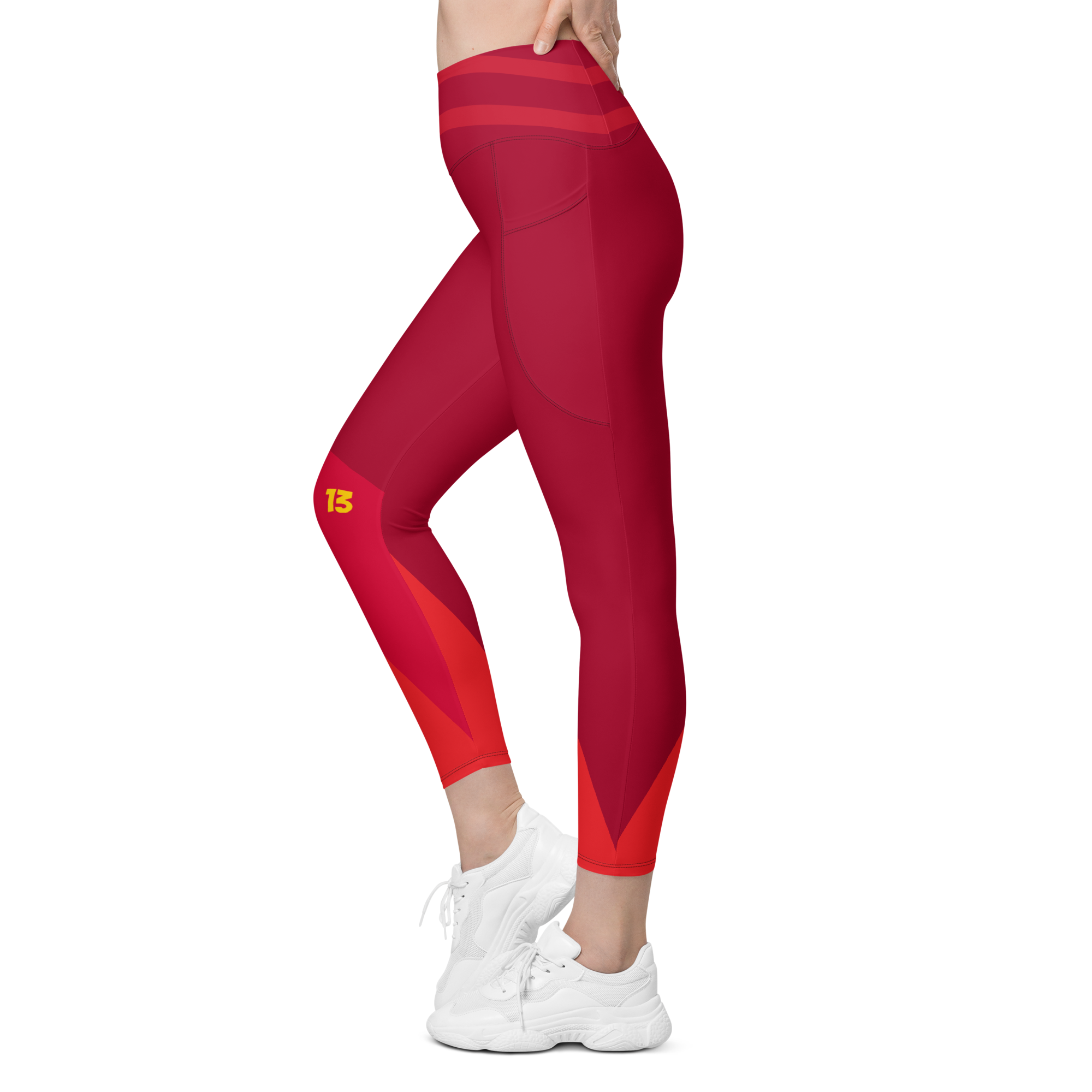 Left side profile of Crimson Ride leggings highlighting the integrated utility pocket and signature '13' hallmark branding.