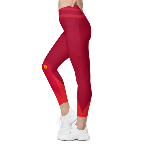 Left side profile of Crimson Ride leggings highlighting the integrated utility pocket and signature '13' hallmark branding.