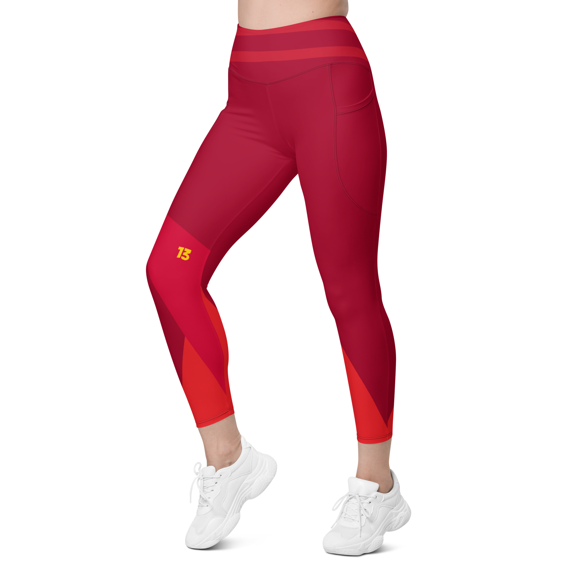 Left side front profile of Crimson Ride leggings highlighting the integrated utility pocket and signature '13' hallmark branding.