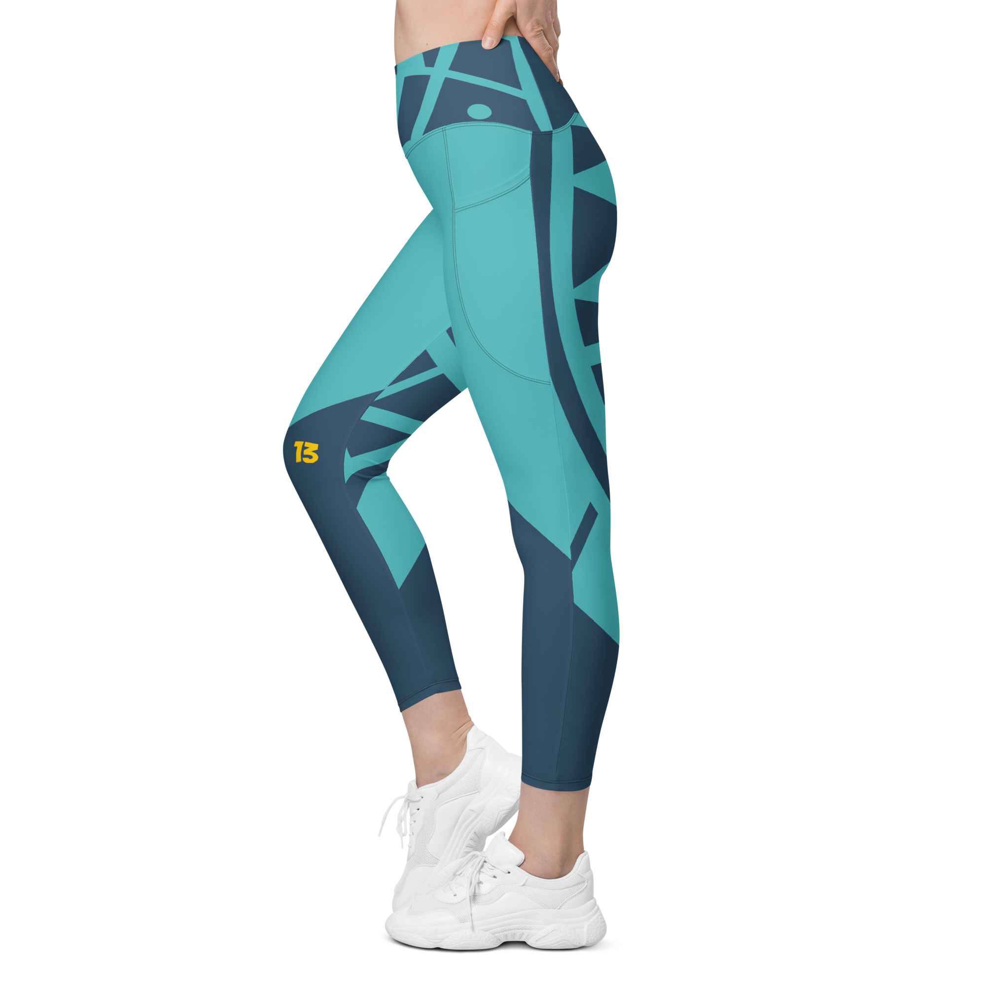 Side profile (Left) of Electric Reef Pocket Leggings showcasing the integrated deep side pocket and streamlined technical profile.