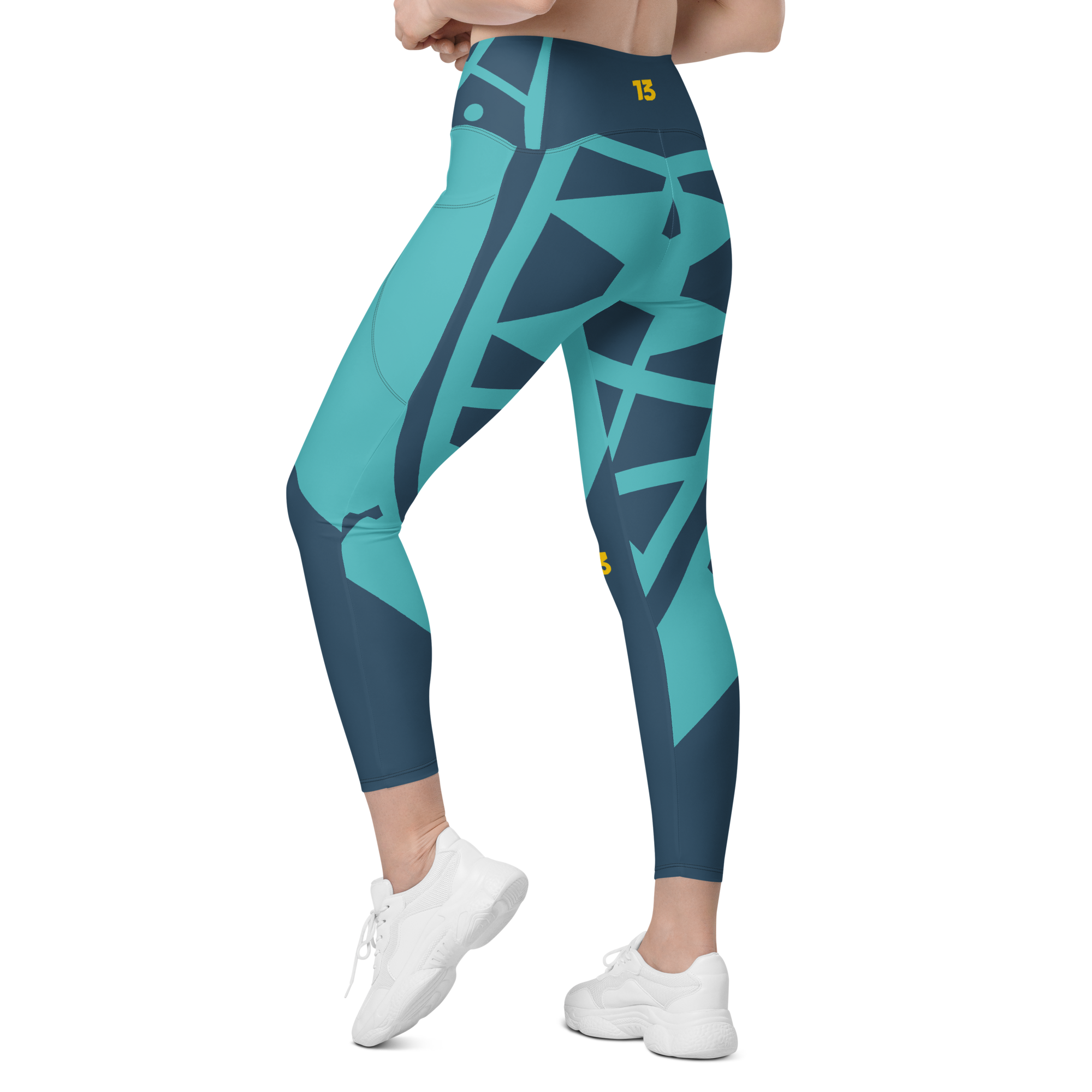 Left rear angle of Electric Reef Leggings highlighting reinforced overlock stitching and ergonomic four-way stretch recovery.