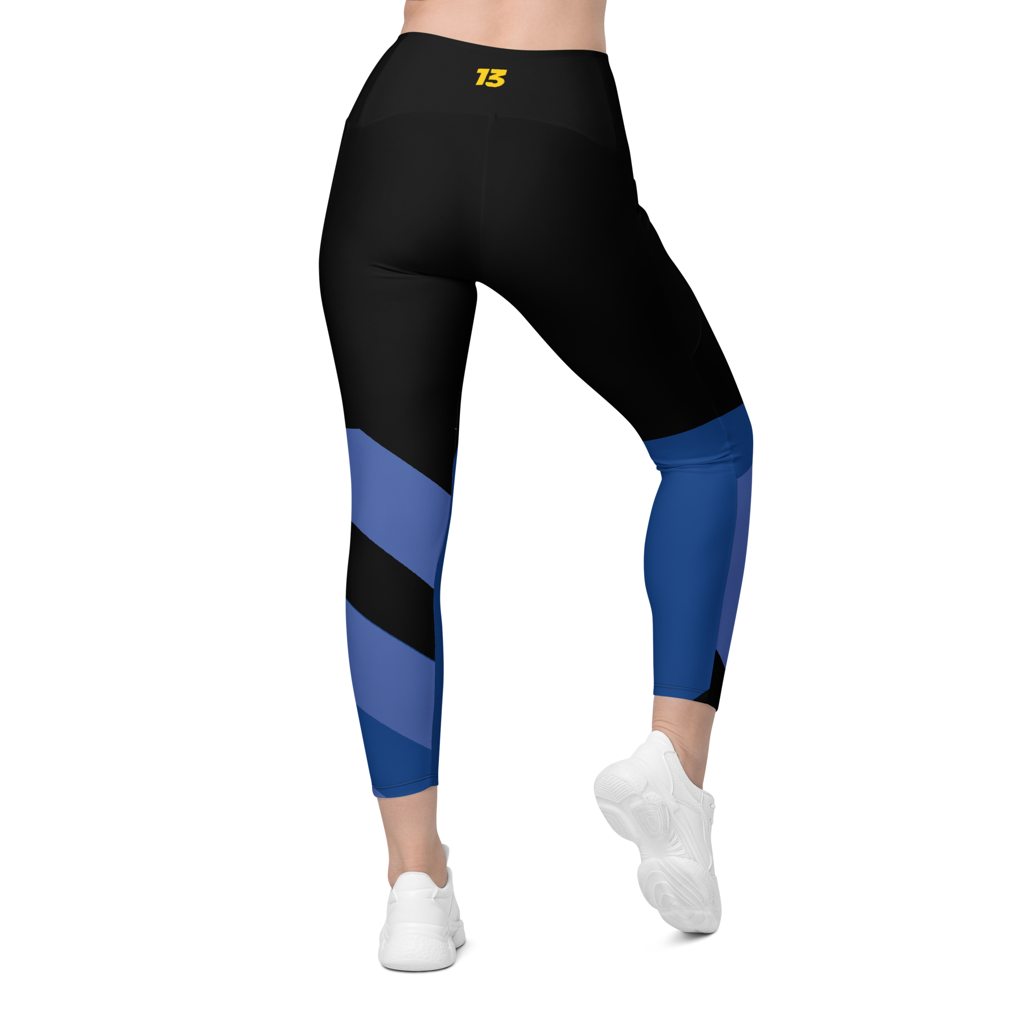 Back side profile of Fragmented Blue leggings highlighting the integrated utility pocket and signature '13' hallmark branding.