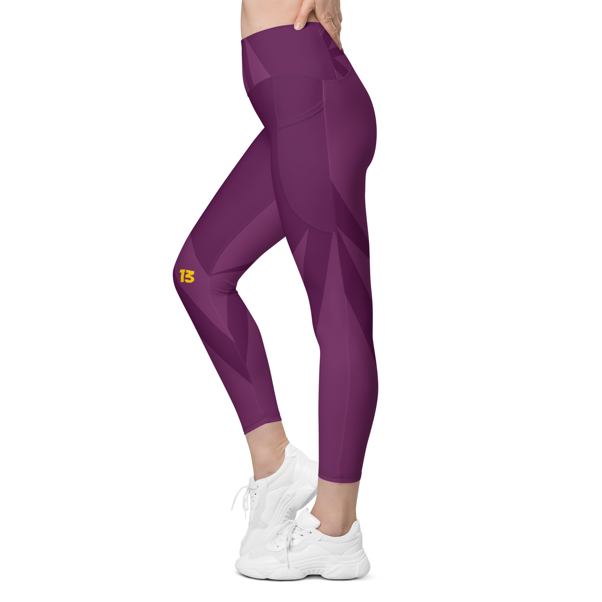 Left side profile of Maroon Haze leggings highlighting the integrated utility pocket and signature '13' hallmark branding.
