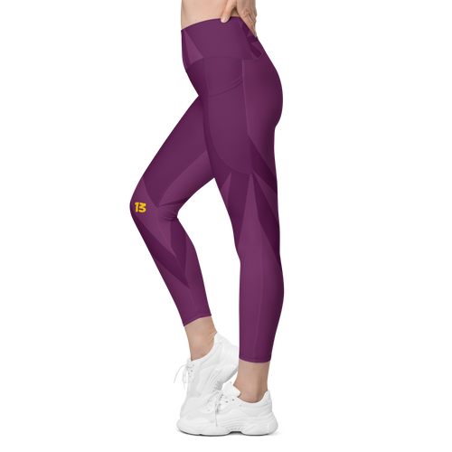 Left side profile of Maroon Haze leggings highlighting the integrated utility pocket and signature '13' hallmark branding.
