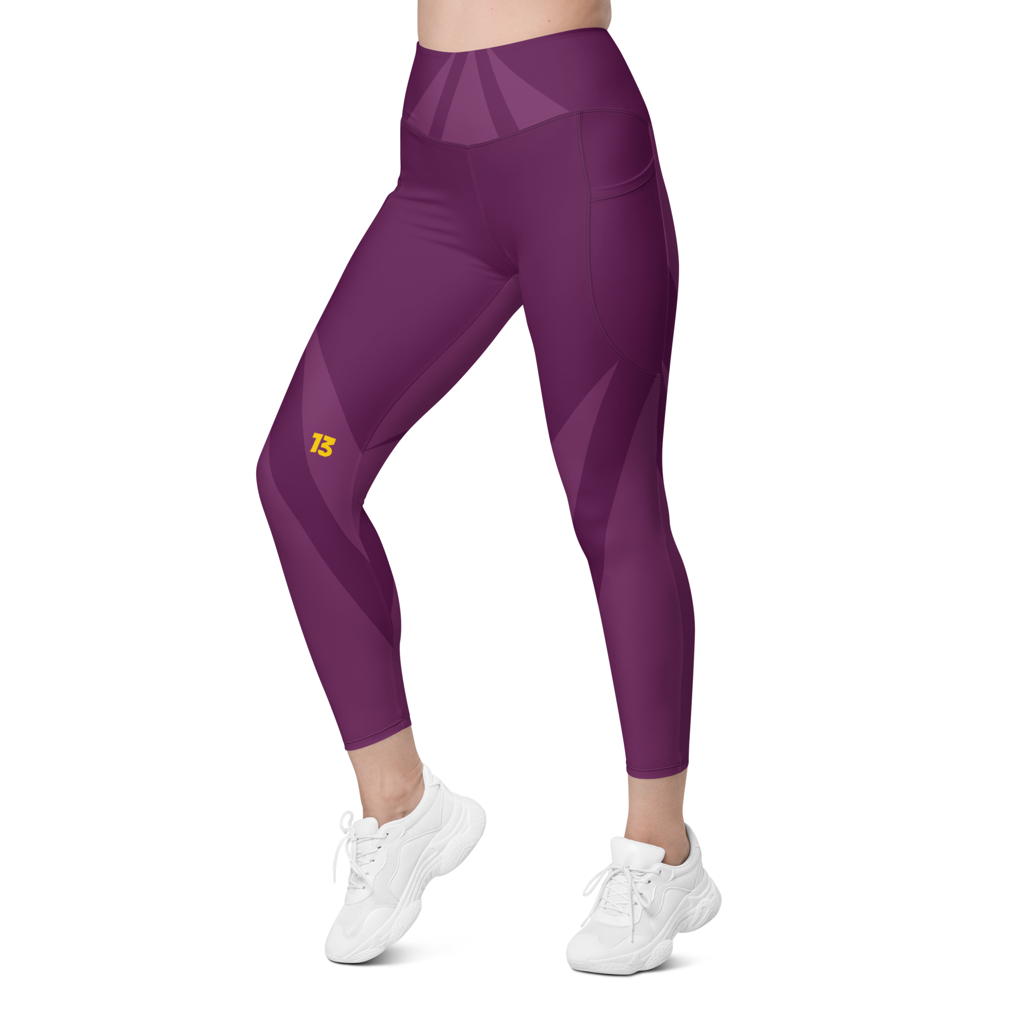 Left side front profile of Maroon Haze leggings highlighting the integrated utility pocket and signature '13' hallmark branding.