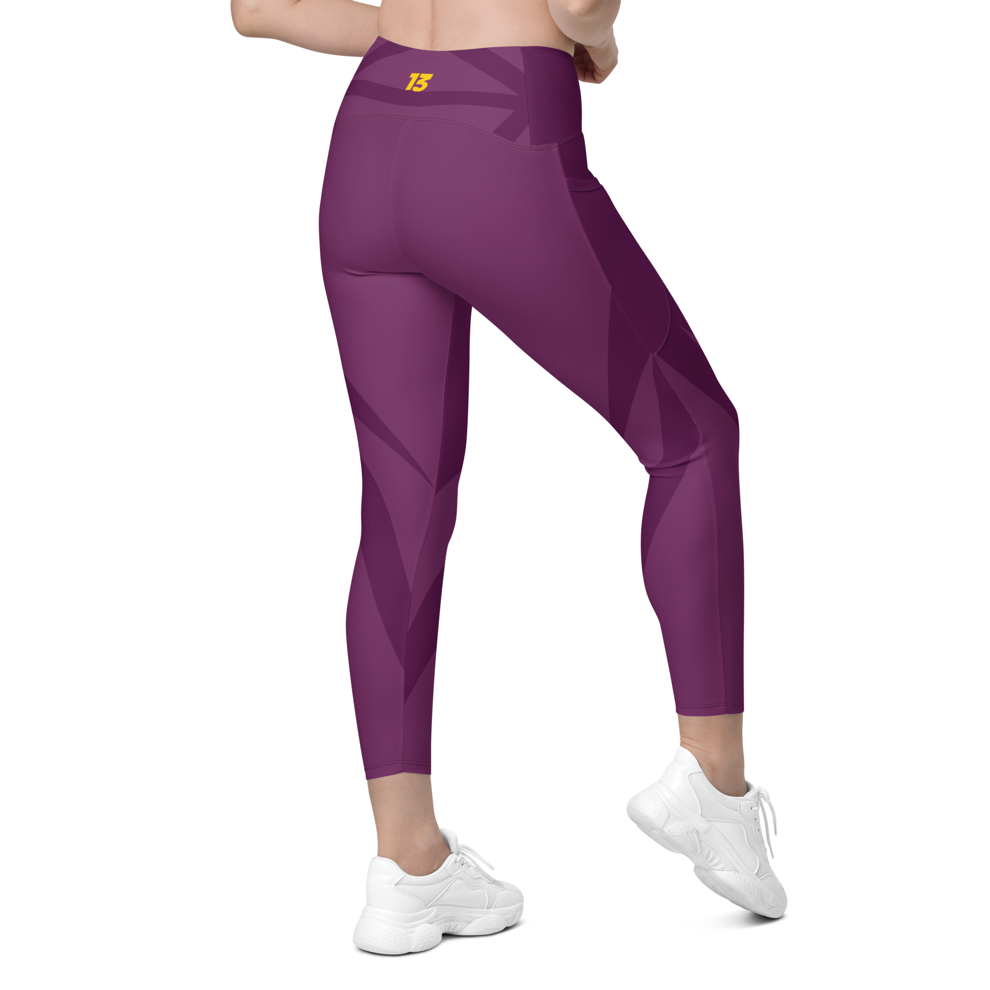 Right side back profile of Maroon Haze leggings highlighting the integrated utility pocket and signature '13' hallmark branding.