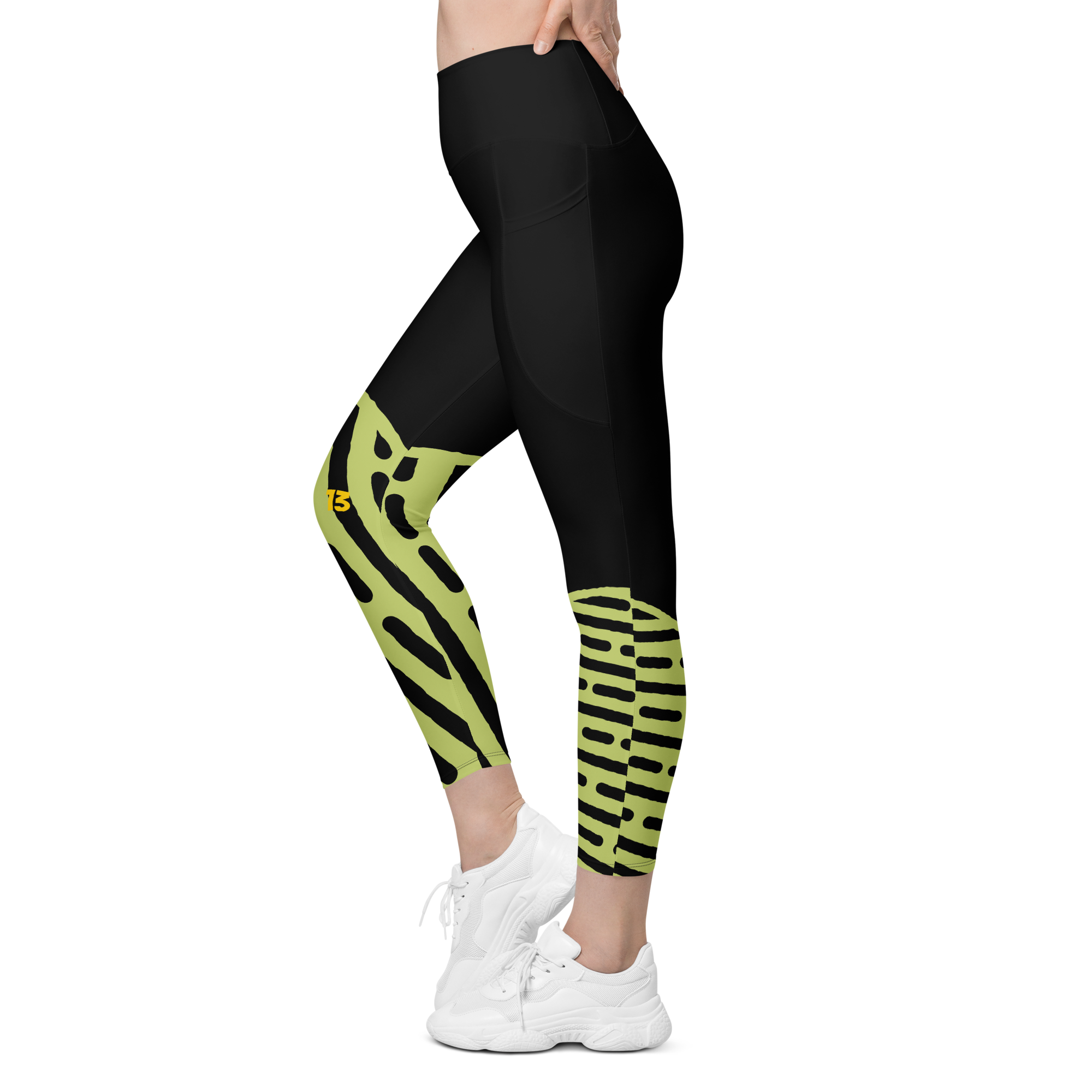 Left side profile of Neon Walk leggings highlighting the integrated utility pocket and signature '13' hallmark branding.