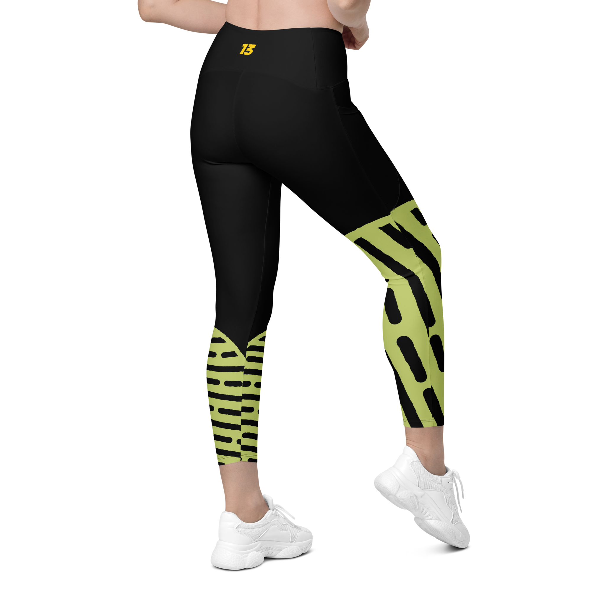 Right side back profile of Neon Walk leggings highlighting the integrated utility pocket and signature '13' hallmark branding.